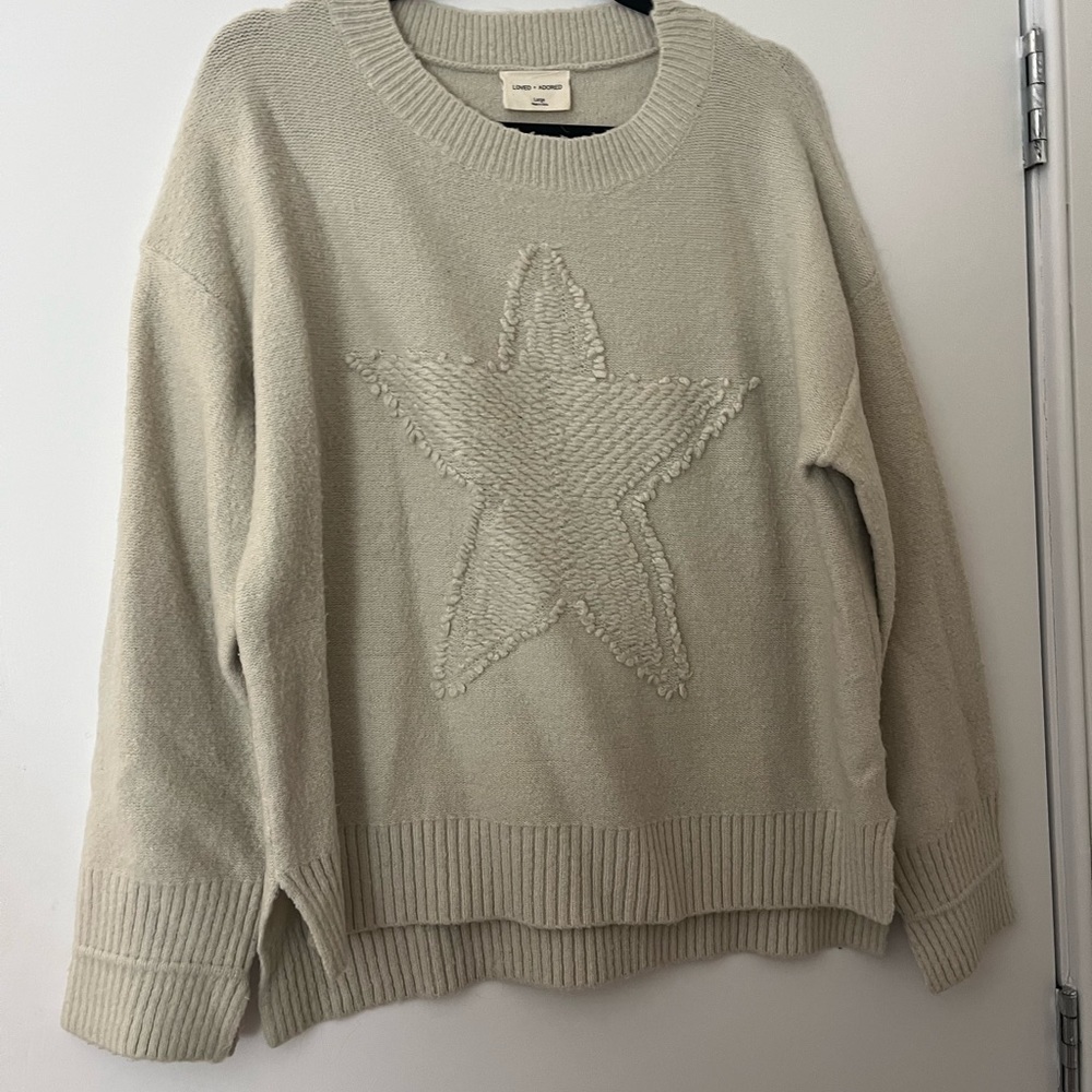 Star sweater one very small stain on sleeve could easily be washed
